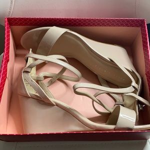 Like new. In original box. Nude wedge sandals.